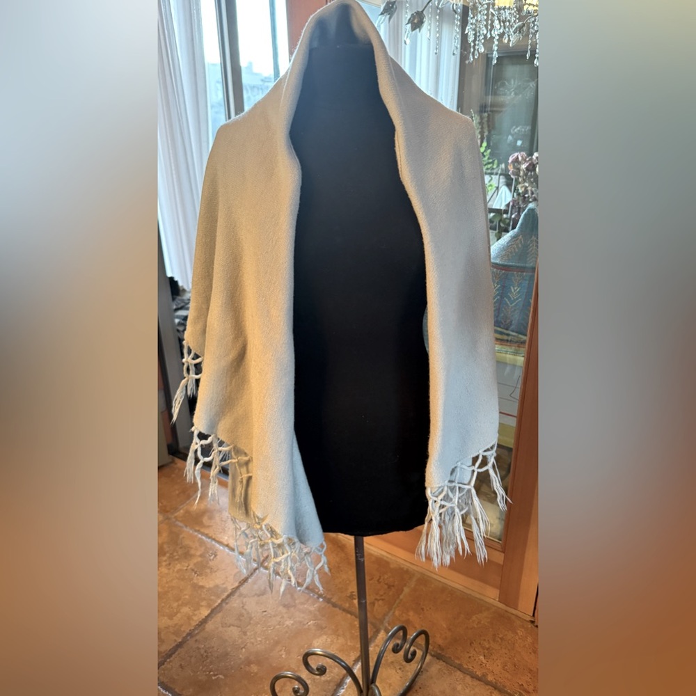 Shawl that has 2 armhole to slip through and keeps the shawl on and in place